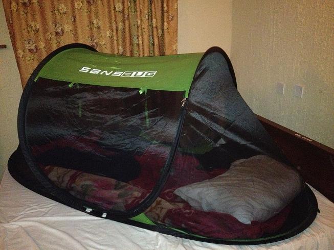 SansBug mosquito tent on a hotel bed in Nigeria